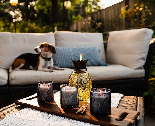 Summer patio with citronella candles and pineapple tiki torch.